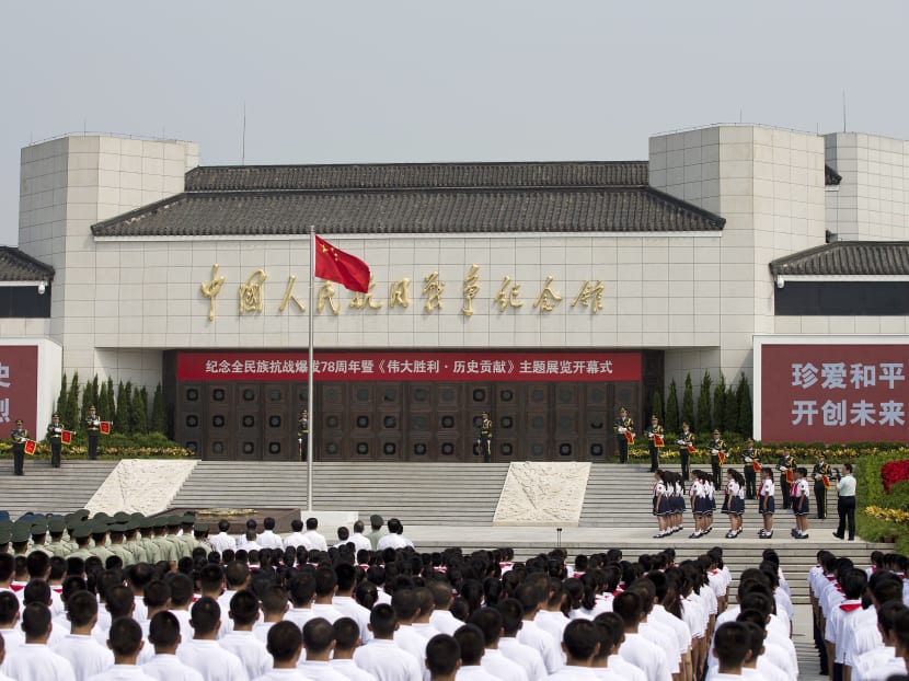 Liu Yunshan, left, a member of the Standing Committee of the Political Bureau of the Communist Party of China, delivers a speech at the opening ceremony of the Museum of the War of Chinese People's Resistance Against Japanese Aggression commemorating the World War II victory over Japan, in Beijing Tuesday, July 7, 2015. Photo: AP