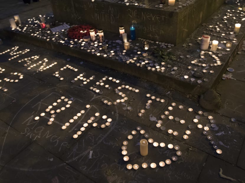 Memorial candles are seen during a vigil on St Ann's Square in Manchester. "Our response to this violence must be to come closer together, to help each other, to love more, to sing louder and to live more kindly and generously than we did before," Ariana Grande said, announcing her star-studded gig. Photo: AFP