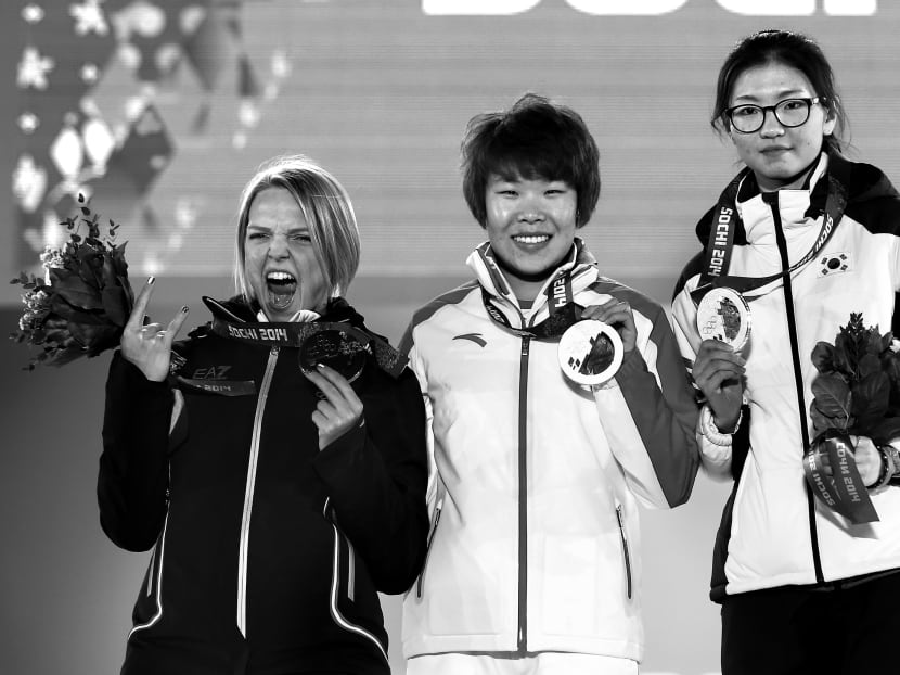From left: 1,500m short-track speed skating bronze medallist Arianna Fontana, champion Zhou Yang and silver medallist Shim Suk Hee. Photo: Getty Images
