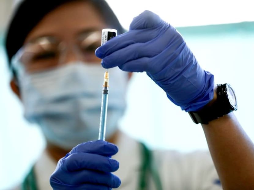 A medical worker fills a syringe with a dose of the Pfizer-BioNTech Covid-19 vaccine, at Tokyo Medical Center in Tokyo, Japan on Feb 17, 2021. 