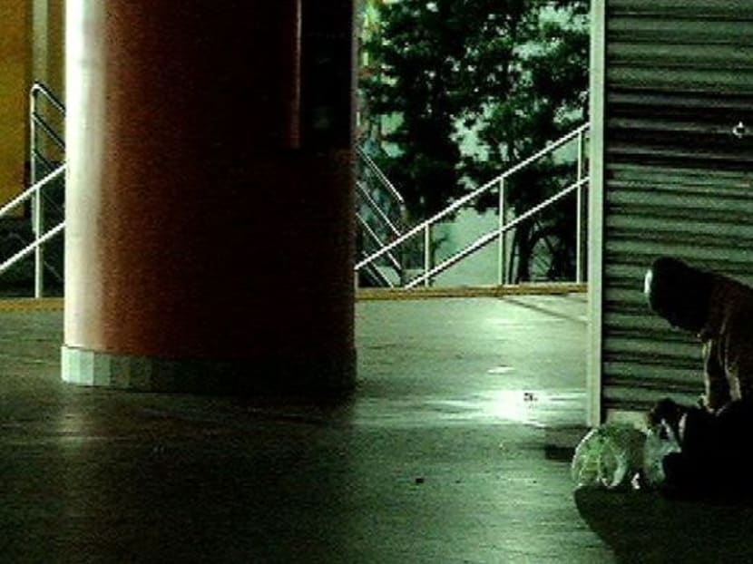 A homeless person in Singapore outside a shop house in the middle of the night. Channel NewsAsia file photo