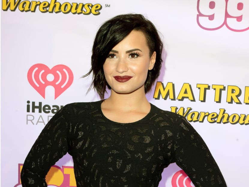 Demi Lovato poses for photographers backstage during the Hot 99.5 Jingle Ball in Washington DC, on Dec 15, 2014. Photo: AP
