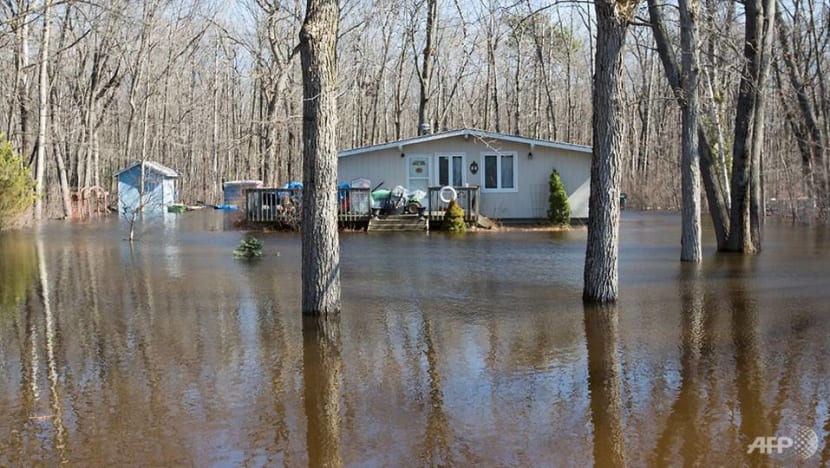 Dike breached, thousands evacuated near Montreal as floods worsen Dike breached, thousands evacuated near Montreal as floods worsen