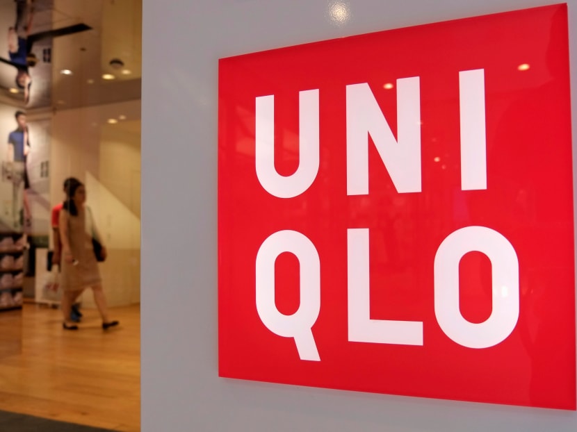Shoppers walk inside Fast Retailing's Uniqlo casual clothing store in Tokyo. Reuters file photo