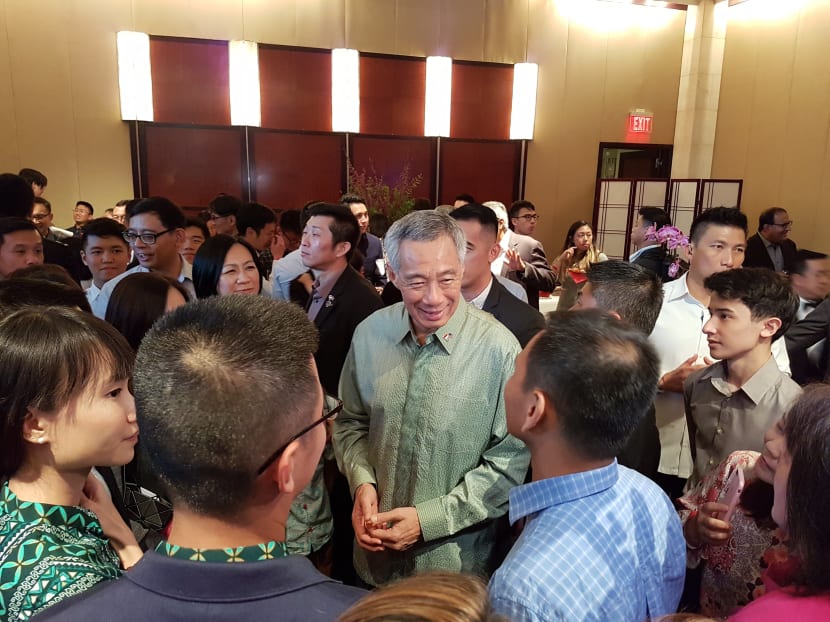 PM Lee Hsien Loong at a reception for Singaporeans in Washington. Singapore’s economy is expected to grow at the “upper end” of the 2 to 3 per cent range, said Prime Minister Lee Hsien Loong, while stressing the need for the Republic to push ahead with industry transformation. Photo: Albert Wai/TODAY