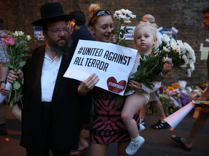 People gather to attend a vigil outside Finsbury Park Mosque, close to the scene of a van attack in Finsbury Park, north London on June 19, 2017. Photo: AFP