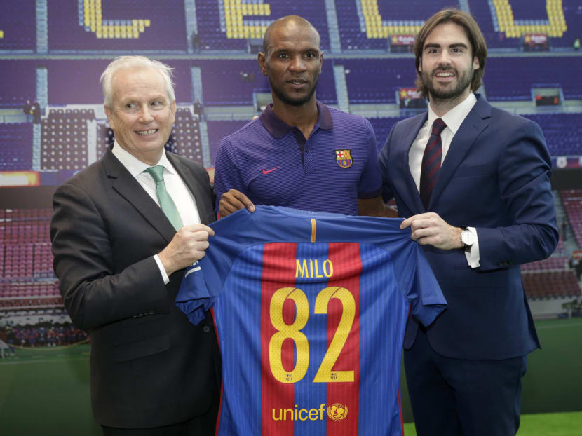 (From left to right): Patrice Bula, Executive Vice President, Nestle S.A, former Barcelona and France star defender Eric Abidal, and Xavier Asensi, Managing Director Asia Pacific, FC Barcelona, at the event to announce the global partnership between Nestle and Barcelona.  PHOTO: WEE TECK HIAN