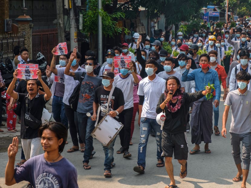Protesters take part in a demonstration against the military coup in Mandalay, Myanmar during the Myanmar New Year festival of Thingyan on April 13, 2021.