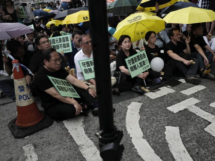 Protesters gather outside the Ming Pao's office building during a rally in Hong Kong on May 2, 2016. Photo: AP