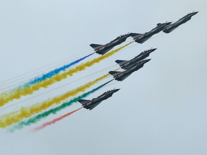 China's People's Liberation Army Air Force Ba Yi aerobatics team perform an aerial display during a media preview of the Singapore Airshow on Feb 9, 2020.