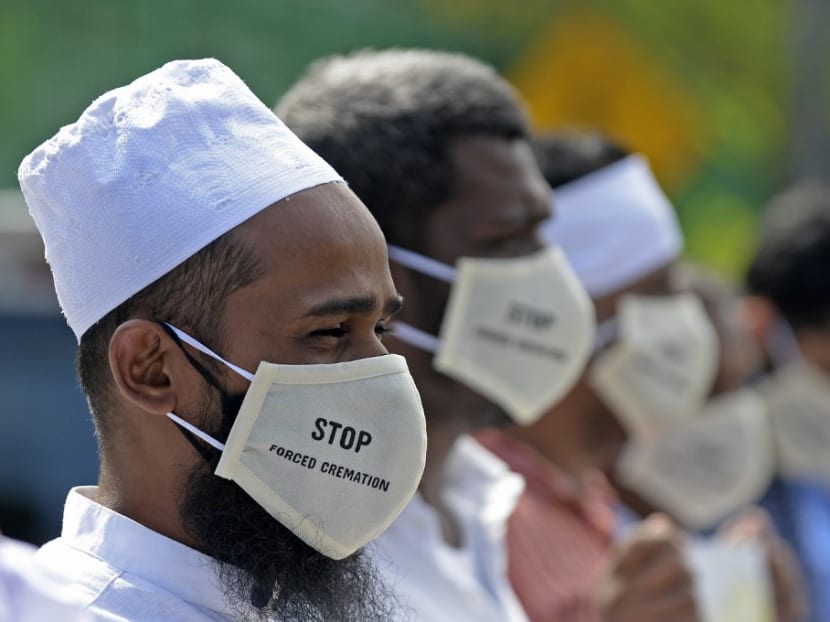 In this file photo taken on Dec 23, 2020, protesters take part in a demonstration against the government policy of forced cremations of Muslims who die of the Covid-19 coronavirus outside a cemetery in Colombo.