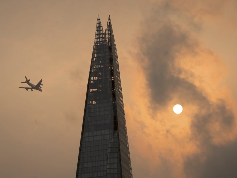 Photo of the day: A plane flies past the Shard in central London, as the sky takes on an unusual orange colour caused by Hurricane Ophelia on Monday, Oct 16, 2017. The unusual occurrence was due to the remnants of the hurricane dragging in tropical air and dust from the Sahara. Photo: AP
