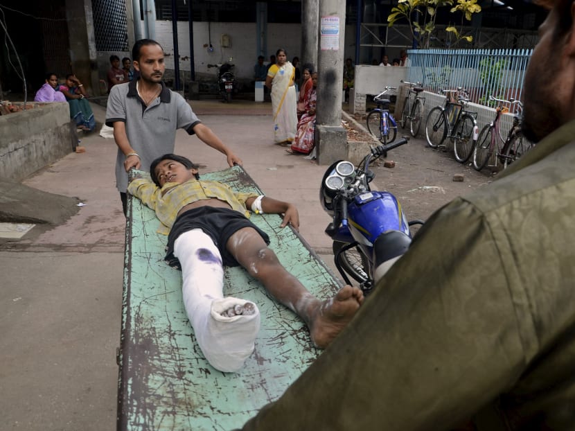 An injured boy is taken to a ward inside a hospital in Siliguri, India, after an earthquake measuring 7.9 magnitude struck Nepal and parts of northern India, authorities in both countries said. Photo: Reuters