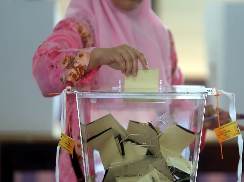 A woman casting her ballot during the May 9 general election. Sarawak was previously known as a 'fixed deposit' state that helped Barisan Nasional retain power, but is this still true today?