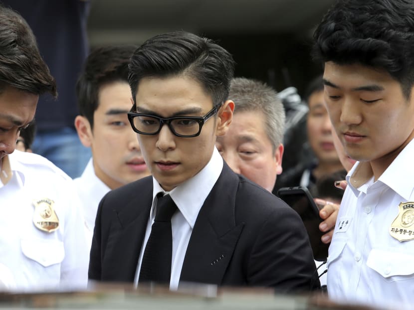 T.O.P., a member of South Korea's idol group Big Bang, leaving the Seoul Central District Court on Thursday (July 20) after his trial on charges of smoking marijuana multiple times last year. Photo: AP