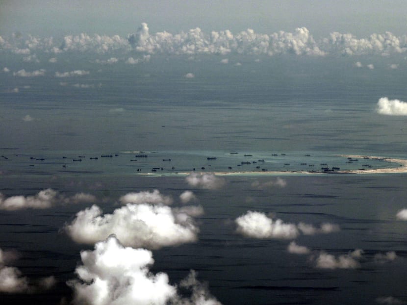 This Monday, May 11, 2015, file photo taken through a glass window of a military plane shows China's alleged on-going reclamation of Mischief Reef in the Spratly Islands in the South China Sea. Photo: AP