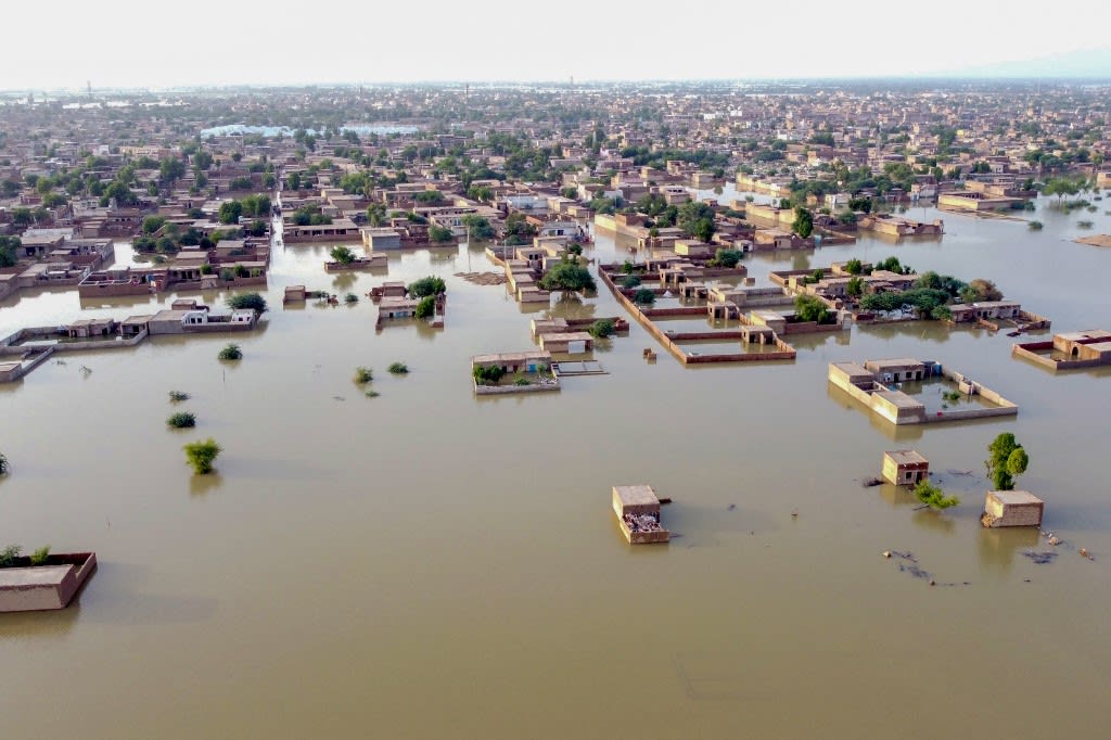 This aerial view shows a flooded residential area after heavy monsoon rains in Balochistan province on Aug 29, 2022. 