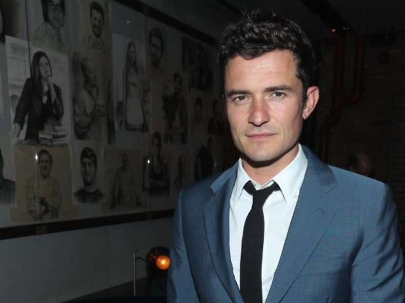 Actor Orlando Bloom mourns dead dog with a tattoo of its name on his chest
