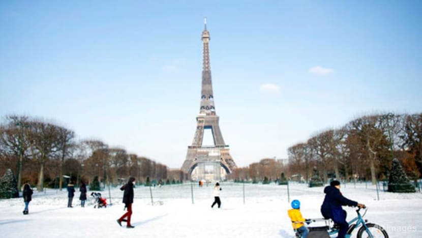 Eiffel Tower needs blowtorch for ice as snow blankets Europe