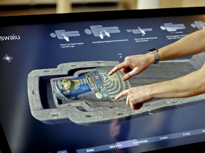Visitors can unwrap an Egyptian mummy virtually and even explore amulets buried with the body. Photo: Interspectral