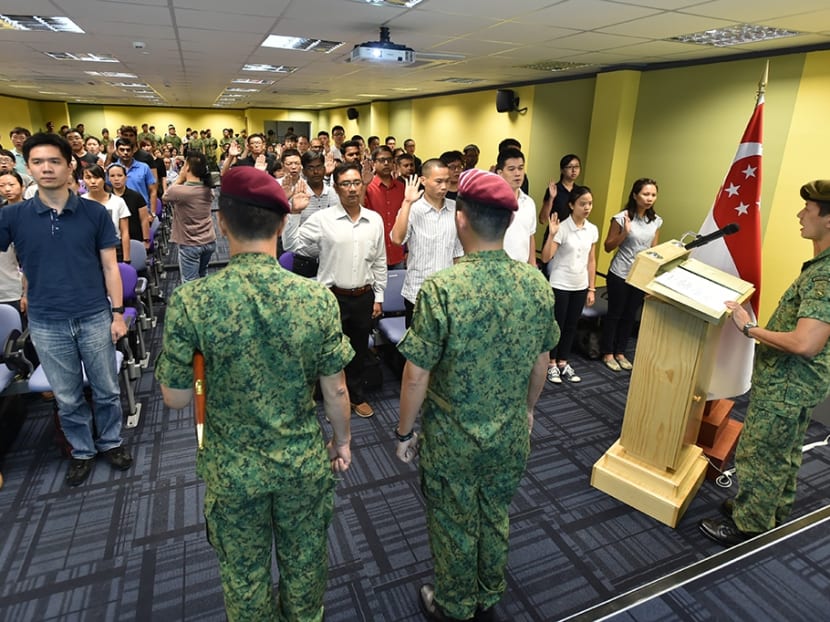 SAFVC Volunteers during the oath-taking ceremony led by Lieutenant Colonel James Yin (far right), Head Training and Plans Branch of the SAF Volunteer Corps. Photo: MINDEF