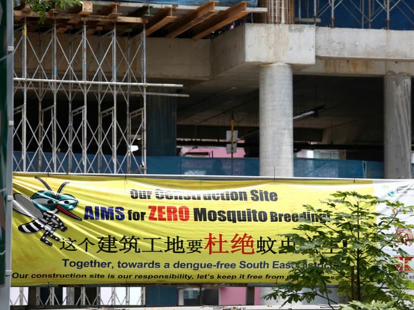 An anti-mosquito-breeding banner outside a construction site. The letter writer believes people need to be on high alert from the start to prevent mosquito breeding. TODAY file photo