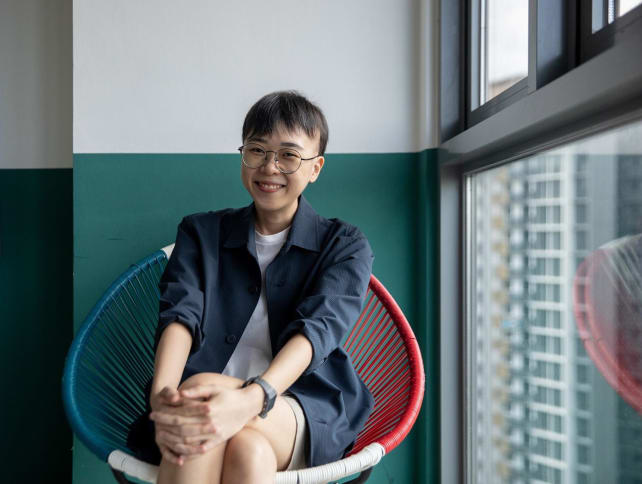 Ms Adeline Tay, 28, a content creator who is also the creative strategist of Our Grandfather Story, poses for a photo at her workplace on May 2, 2024. She was diagnosed with alopecia in 2016. 