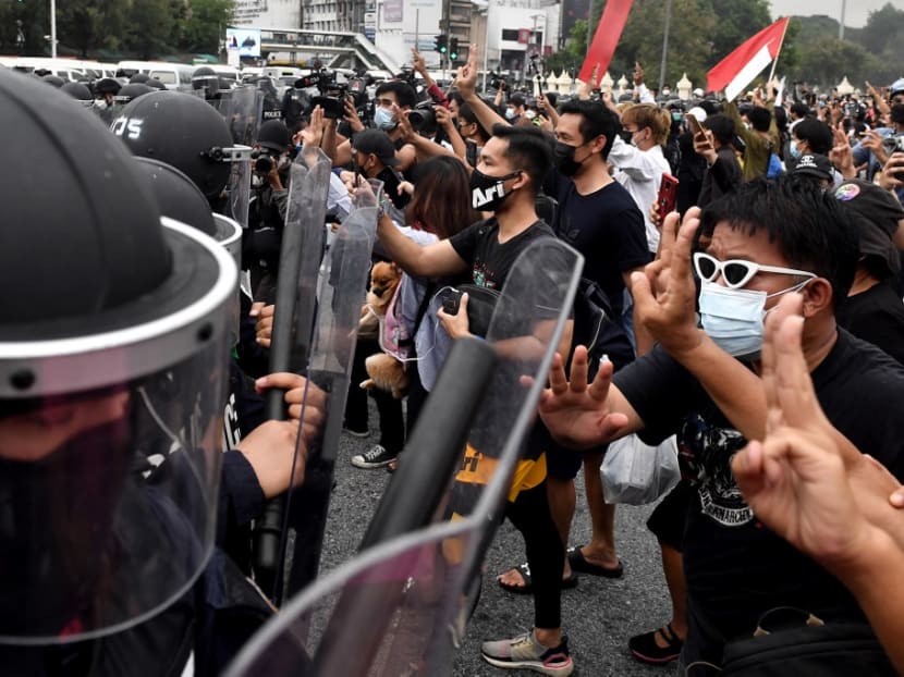Pro-democracy protesters confront riot police during a protest calling for the resignation of prime minister Prayut Chan-Ocha over the Thai government’s handling of the Covid-19 coronavirus crisis and changing the current legislation, in Bangkok on Wednesday, Aug 11, 2021.