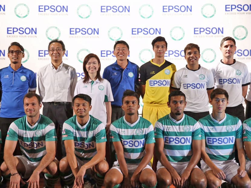 Geylang United Head Coach Hasrin Jailani, MD of Epson Toshimitsu Tanaka, Adviser Tin Pei Ling and Club Chairman Ben Teng pose for a photo with Geylang Untied players shortly after a press conference to announce a partnership between Epson and Geylang United.Don Wong.