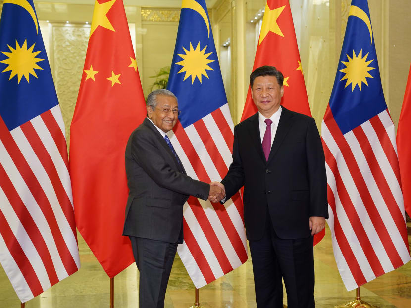 Chinese President Xi Jinping shakes hands with Malaysian Prime Minister Mahathir Mohamad before the bilateral meeting of the Second Belt and Road Forum at the Great Hall of the People in Beijing, China, April 25, 2019.