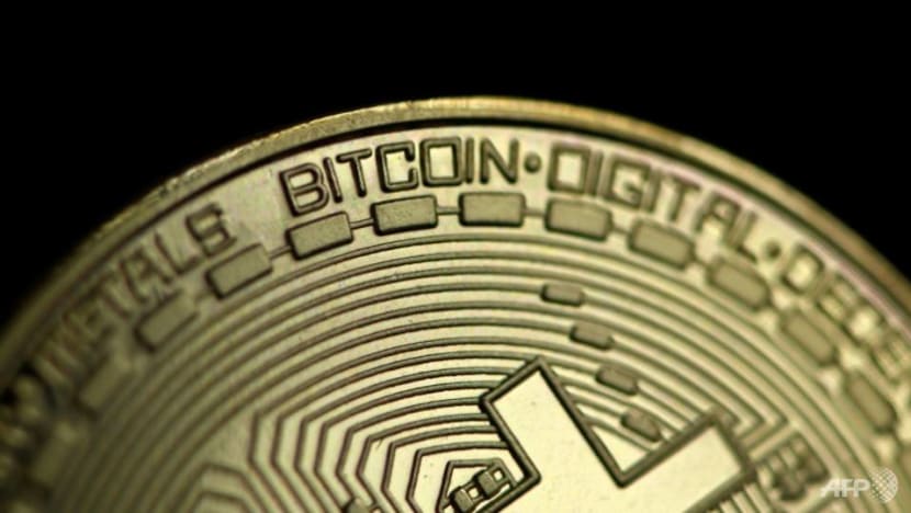 Bitcoin slumps 14% as pullback from record gathers pace
