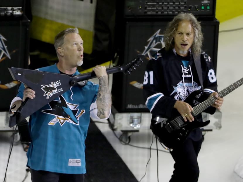 Metal on ice: James Hetfield and Kirk Hammett of Metallica performing at the NHL match. The metal band will headling this year's Global Citizen Festival. Photo: AFP
