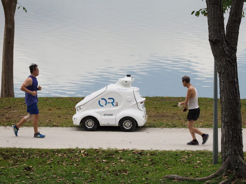 Miniature robot car goes on pedestrian paths to remind visitors to adhere to safe distancing rules