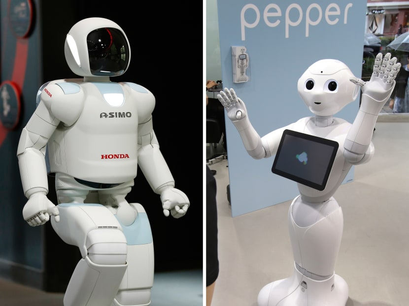 Honda Motor Co’s walking robot Asimo (left) and Japanese Internet company SoftBank's humanoid robot Pepper. Photo: AP