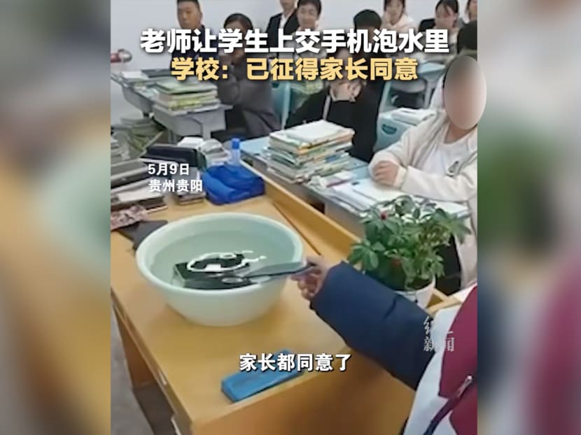 A video showed students from China putting their mobile phones in a basin of water as a form of punishment. A video showed students from China putting their mobile phones in a basin of water as a form of punishment.