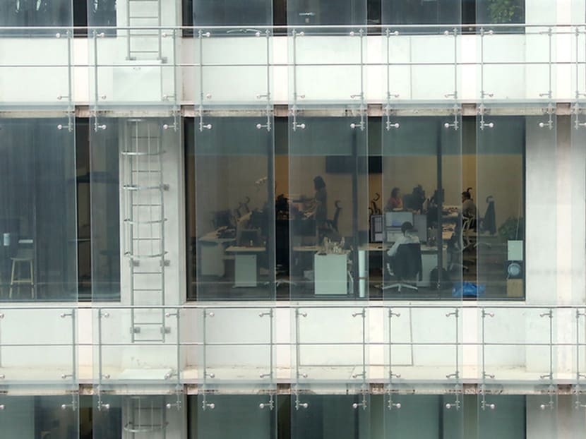 People working in an office in the Central Business District. People working in an office in the Central Business District.