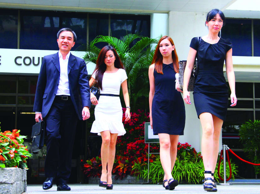 City Harvest Church trial: John Lam (left), Serina Wee (white), Sharon Tan (right) leaving the State Courts, April 8, 2014. Photo: Ernest Chua