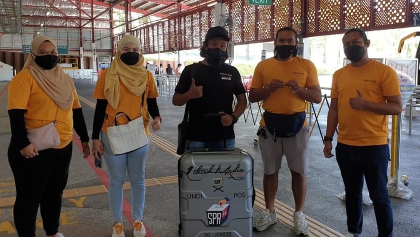 Johor state election: Volunteers deliver final batch of 1,021 postal ballots from Singapore Johor state election: Volunteers deliver final batch of 1,021 postal ballots from Singapore