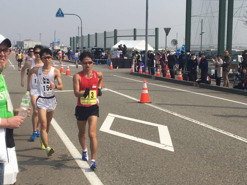 Edmund Sim (in red) competing at the Asian 20km Race Walking Championships in Japan. Photo courtesy of Peter James Back, Singapore Athletics