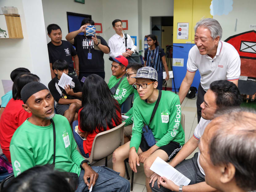 Food-delivery riders with Pasir Ris-Punggol GRC Member of Parliament Teo Chee Hean at his meet-the-people session on Nov 8, 2019.