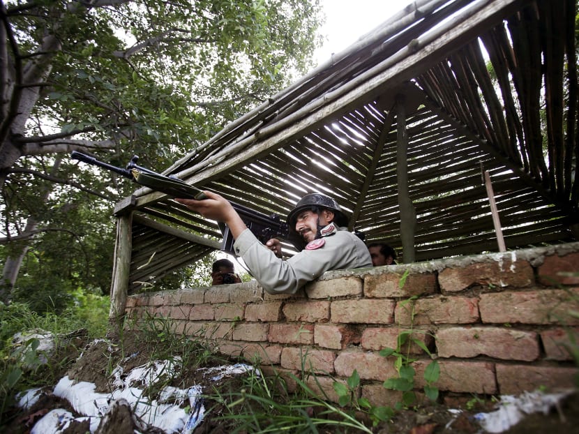 A Pakistani soldier monitoring the border of Pakistan and India in Dhamala Hakimwala, Pakistan. Fighting between the countries halted yesterday after days of heavy shelling. Photo: AP