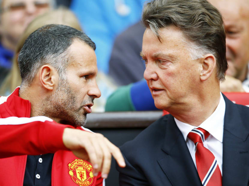 Claims of Giggs (left) being concerned about Van Gaal’s cautious approach have emerged. Photo: Reuters