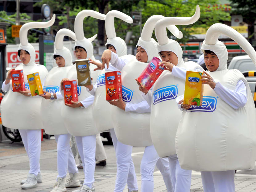 Men dressed as sperm. AFP file photo