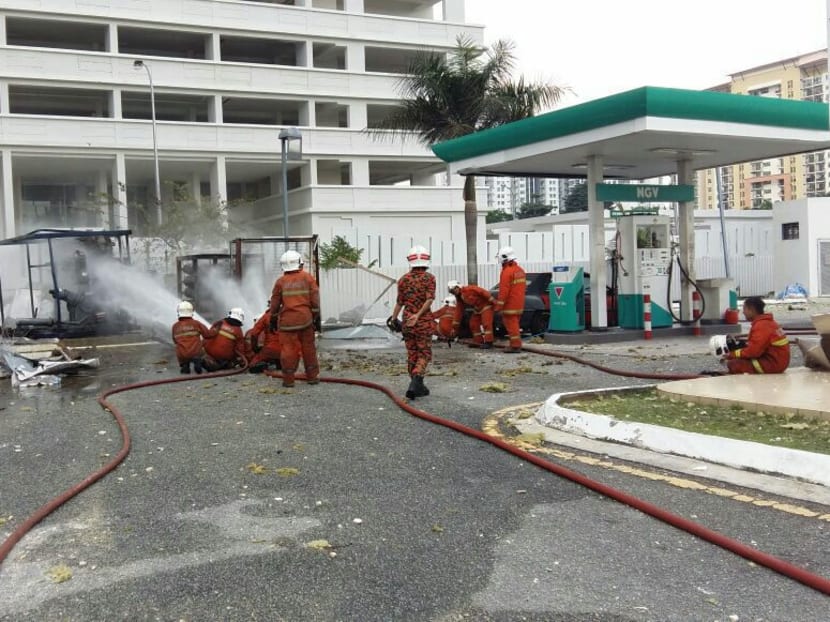 Firemen at the scene of the explosion in Taman Mount Austin, Johor. Photo: Fire and Rescue Department Malaysia/Twitter