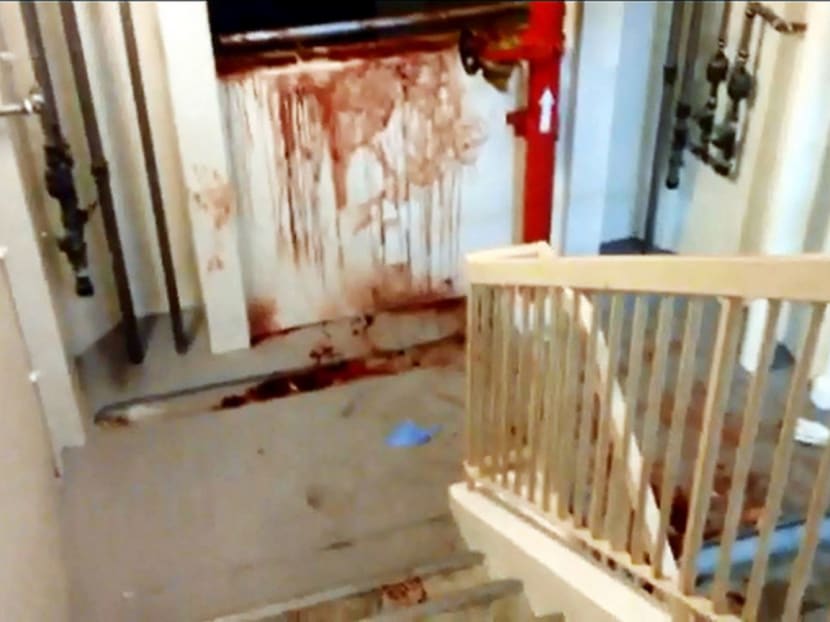 A screengrab from a Channel NewsAsia video showing a blood-stained stairway in the vicinity of the alleged murder in Tampines.