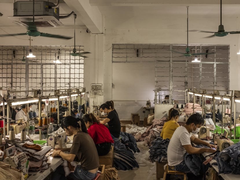 Garment factory workers in Guangzhou, China. Garment factory workers in Guangzhou, China.