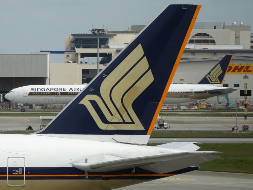 Singapore Airlines planes sit on the tarmac at Changi Airport in Singapore Dec 8, 2020.
