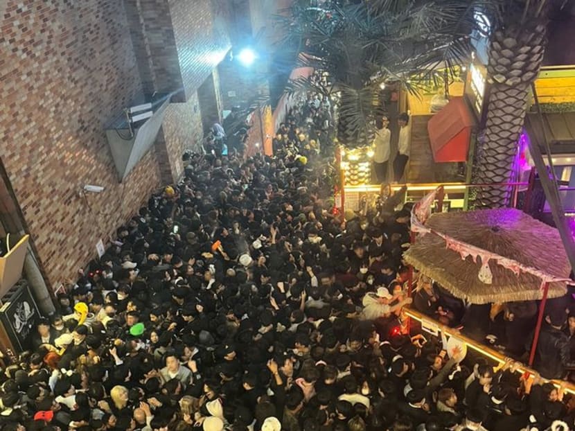 A street in Itaewon district is pictured full of people before a stampede during Halloween festivities killed and injured many in Seoul, South Korea, in this image released by Yonhap on October 30, 2022. Yonhap via 