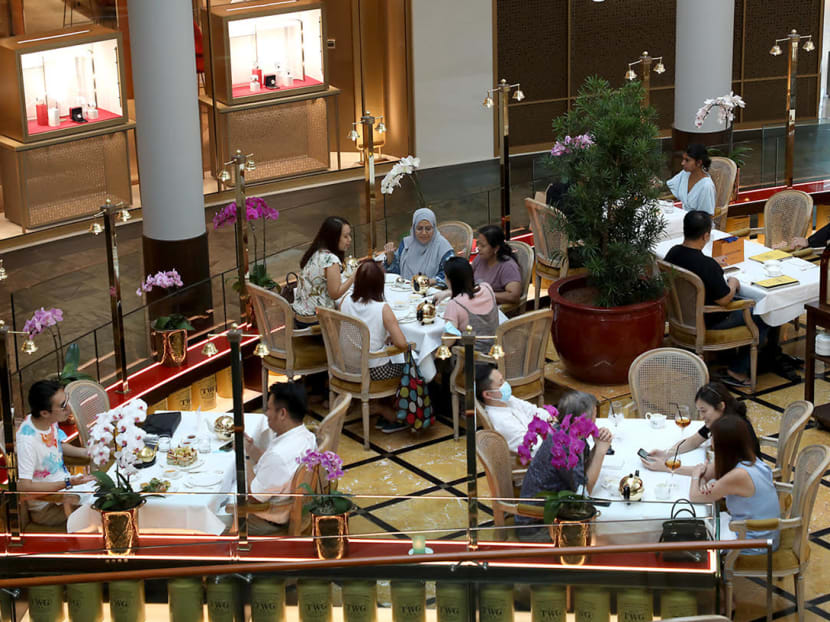 Diners at a restaurant in The Shoppes at Marina Bay Sands integrated resort.