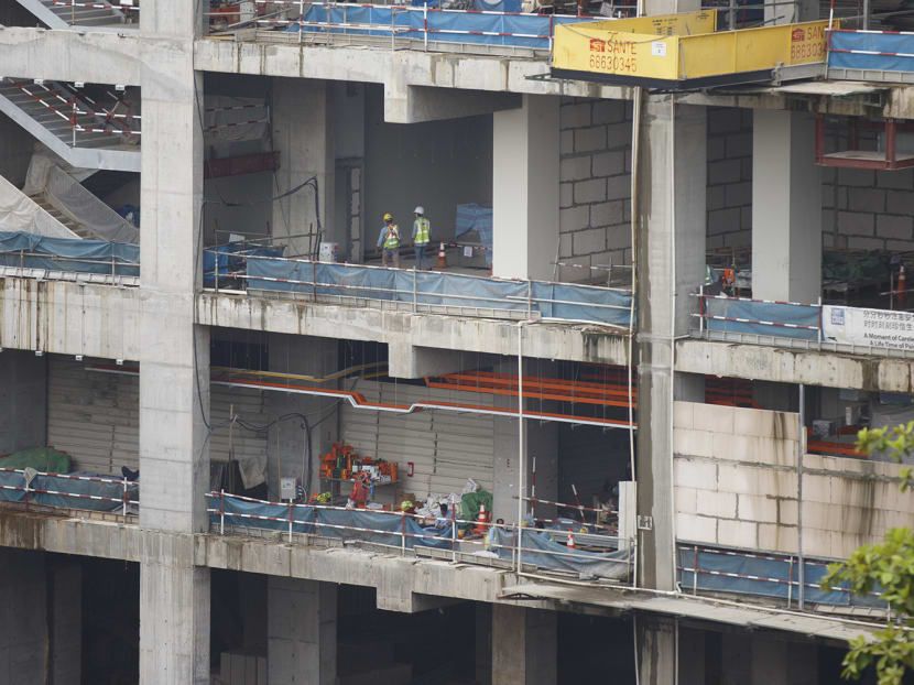 Workers at a construction site along Jalan Bukit Merah on May 13, 2022.